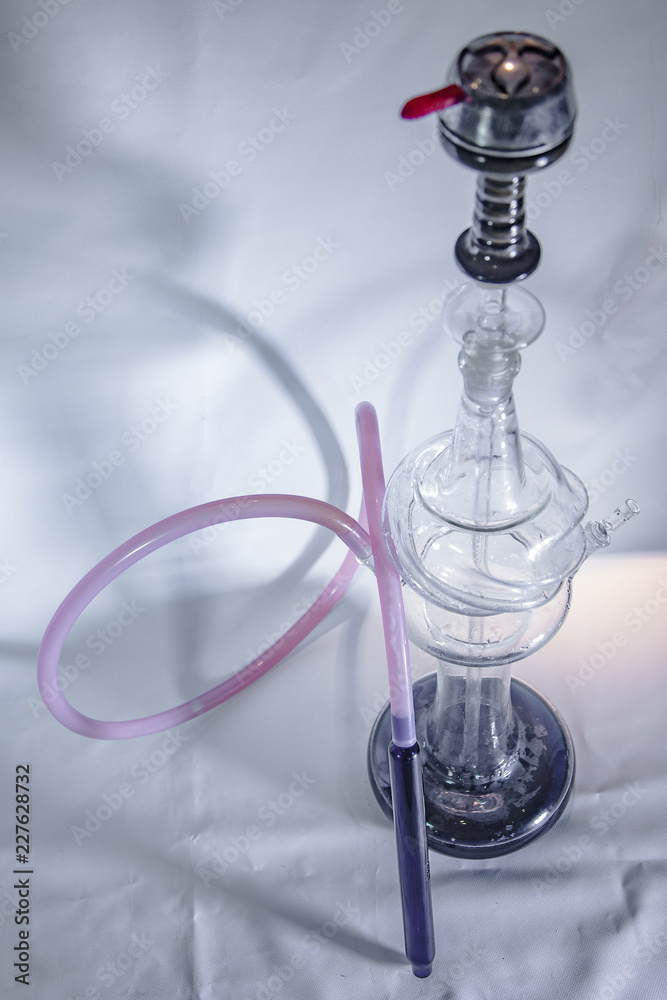 New Glass Hookah with beautiful backlight in the cafe. New Glass Hookah with beautiful backlight in the cafe.