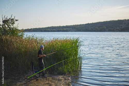 man fishing on the lake