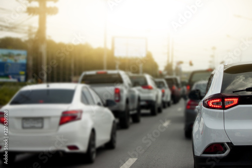 Cars on the road heading towards the goal of the trip. or stop by traffic jam by light control. © thongchainak