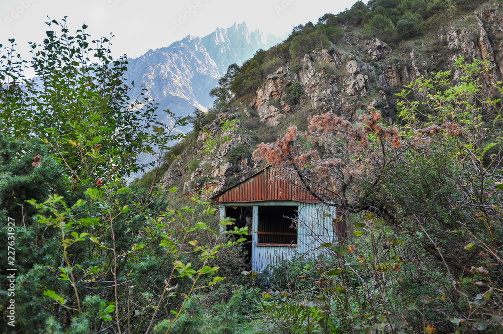 Lonely house in the mountains at the foot of the  Gveleti Waterfalls near Kazbegi, Giorgia 