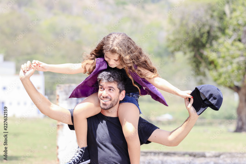 Fototapeta premium Father and daughter having fun outdoors