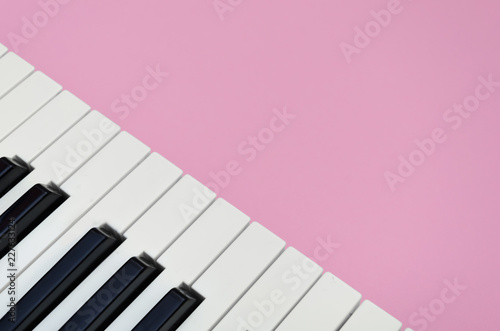 Pink music background with a piano  in the left corner