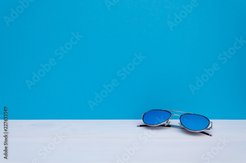 Summer fashion. Sunglasses with the blue lens