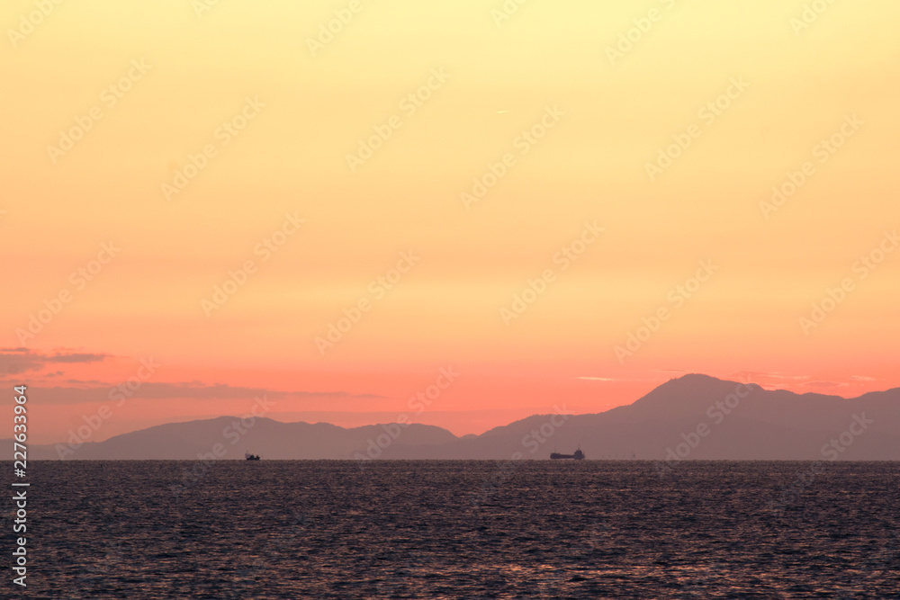 Awaji-island with a sunset view / 夕暮れ時、淡路島を臨む。