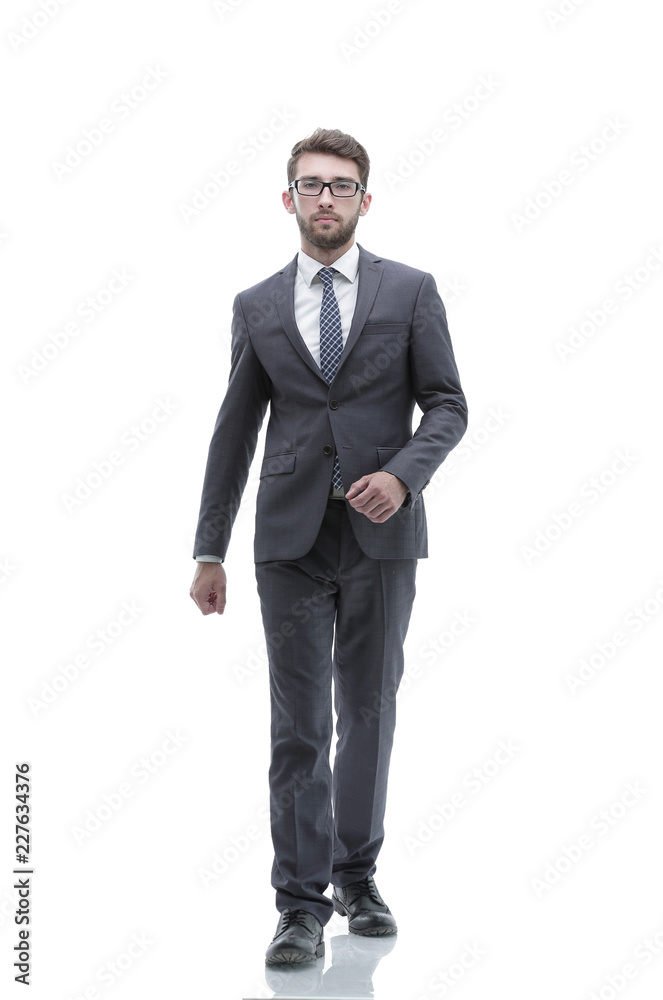 confident businessman goes forward. photo in full growth. confident businessman goes forward. photo in full growth.