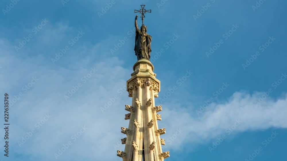 The top of the Cathedral of the Holy Cross and Saint Eulalia located in Gothic quarter of Barcelona. White clouds move across blue sky. Time lapse video. The top of the Cathedral of the Holy Cross and Saint Eulalia located in Gothic quarter of Barcelona. White clouds move across blue sky. Time lapse video.