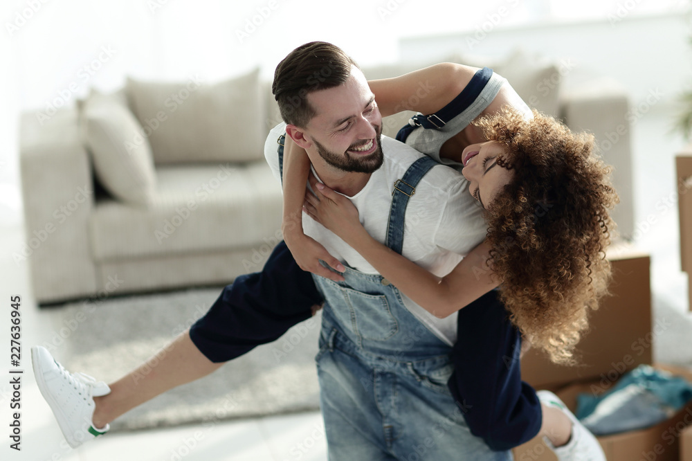 Wife and husband are happy to move to a new home. Wife and husband are happy to move to a new home.
