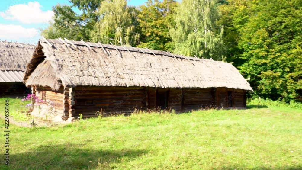Rustic rural houses with thatched roofs Rustic rural houses with thatched roofs