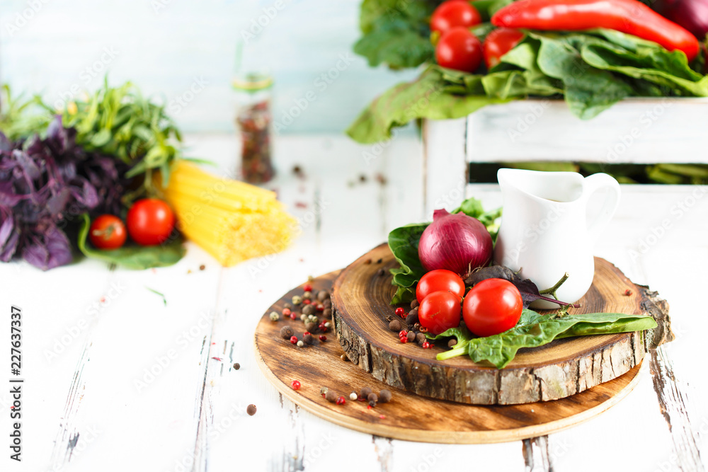 Cherry, tarragon, spaghetti, chili pepper, basil, spices Ingredients for cooking pasta. Food background Cherry, tarragon, spaghetti, chili pepper, basil, spices Ingredients for cooking pasta. Food background