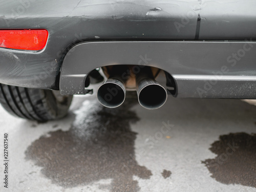 Exhaust pipe of black car