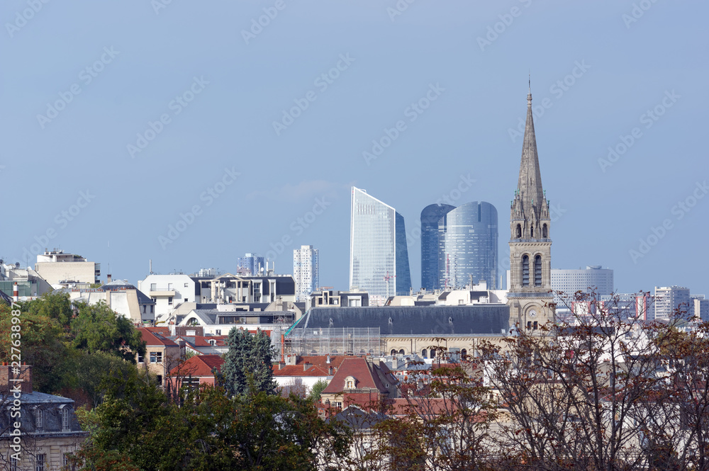 old church and La Defense towers in Paris suburb