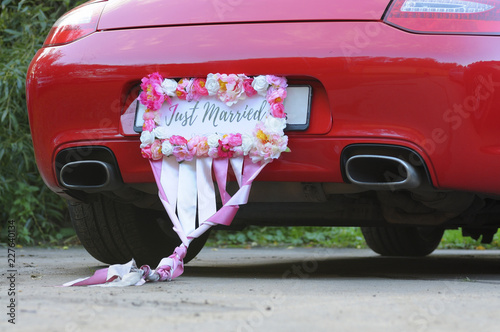 Bumper of limousine with just married sign attached