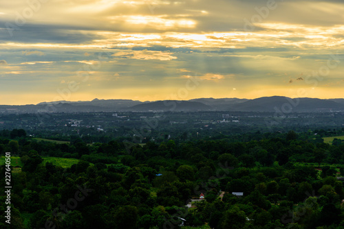 Landscape of cloudy, mountain and forest with sunset in the evening from top view.