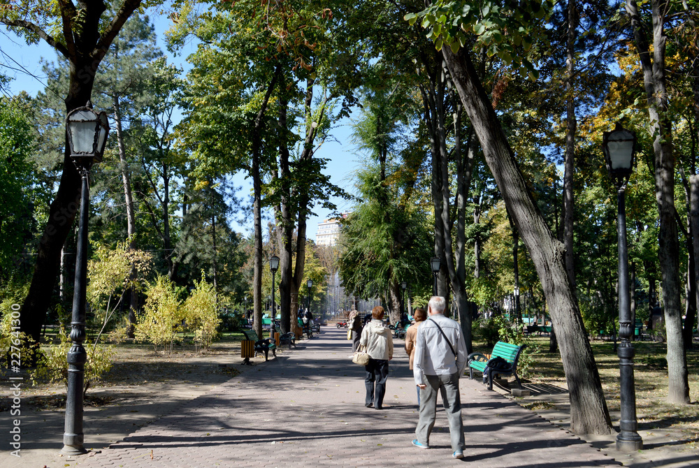 Fototapeta premium Walkers in Stefan cel Mare park, Chisinau, Moldova