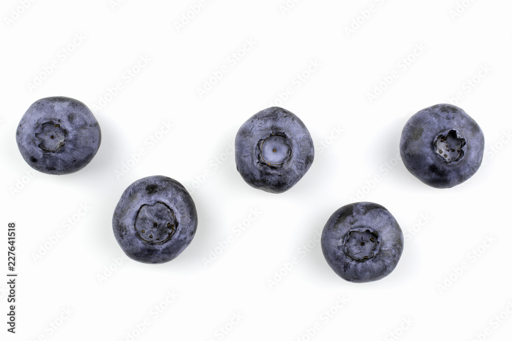 Five berries of blueberry are isolated on a white background. Five berries of blueberry are isolated on a white background.
