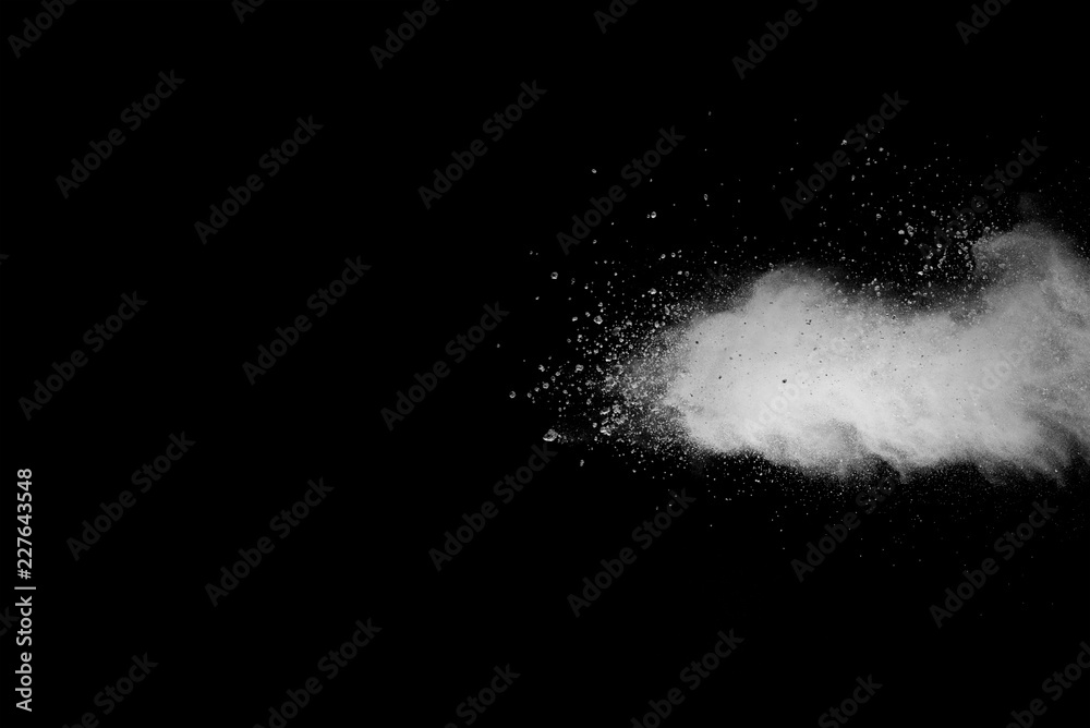 Explosion of white dust on black background.