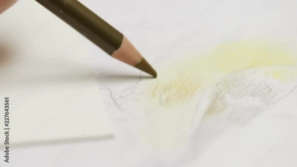 Detailed macro view of colored pencil drawing on paper, 2x slowmotion Detailed macro view of colored pencil drawing on paper, 2x slowmotion