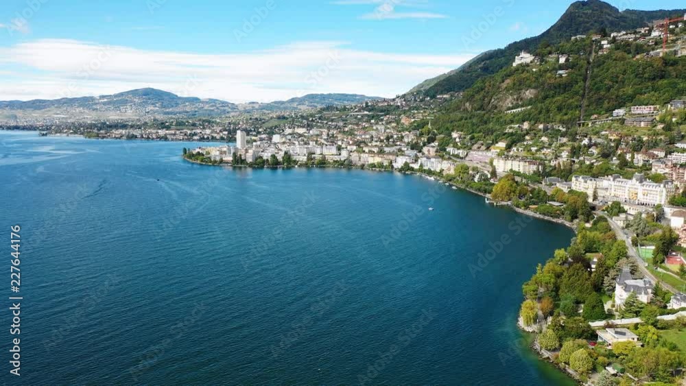 Aerial panoramic view of city of Montreux, resort town by Geneva Lake (Lac Leman), late summer - landscape panorama of Switzerland from above, Europe Aerial panoramic view of city of Montreux, resort town by Geneva Lake (Lac Leman), late summer - landscape panorama of Switzerland from above, Europe