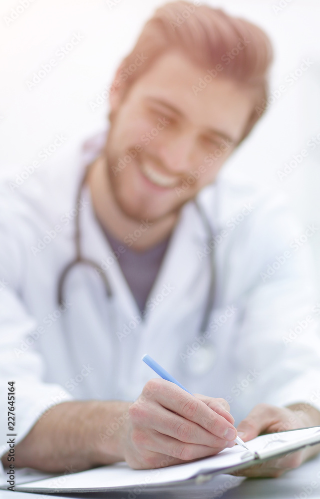 background image of a doctor writing out a prescription background image of a doctor writing out a prescription