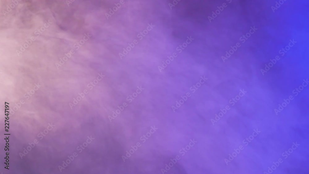 Colorful abstract purple and blue smoke over a black background in studio. 4K footage Colorful abstract purple and blue smoke over a black background in studio. 4K footage