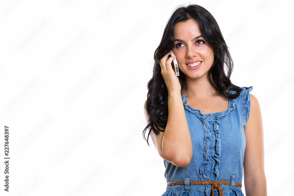 Studio shot of happy beautiful Spanish woman smiling and talking Studio shot of happy beautiful Spanish woman smiling and talking