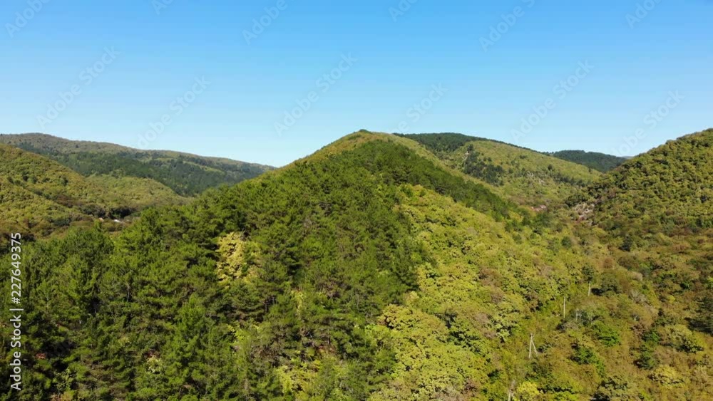 Aerial of flying over a beautiful green forest in a rural landscape in Krasnodar region. Aerial of flying over a beautiful green forest in a rural landscape in Krasnodar region.