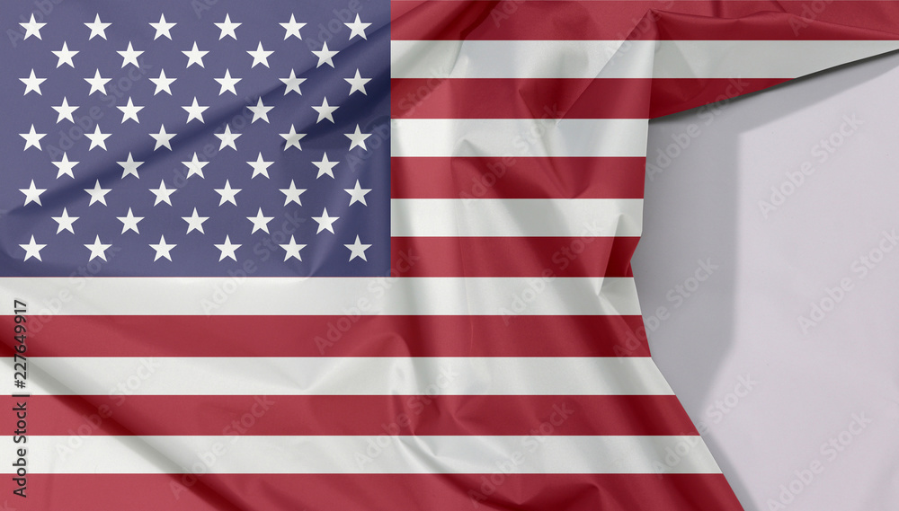 Fototapeta premium United States of America fabric flag crepe and crease with white space, horizontal stripes of red and white with fifty white stars on a blue field.