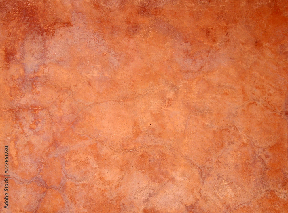 old orange brown painted faded stained cracked rough plaster wall background