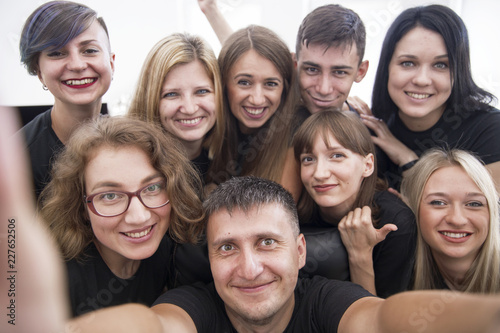 Self portrait of young project team in casual outfit shooting selfie on front camera with joyful cheerful expression having leisure, timeout. Startup © pokryvka