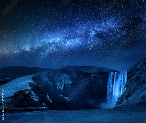 Milky way and falling stars over Skogafoss waterfall in Iceland photo