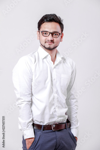 young indian man Standing isolated over white background