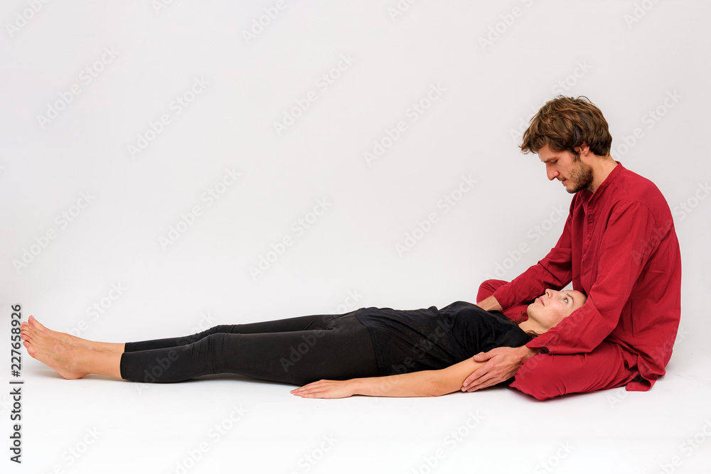 Photo of yoga poses for two stretching and relaxing on a white background. Photo of yoga poses for two stretching and relaxing on a white background.