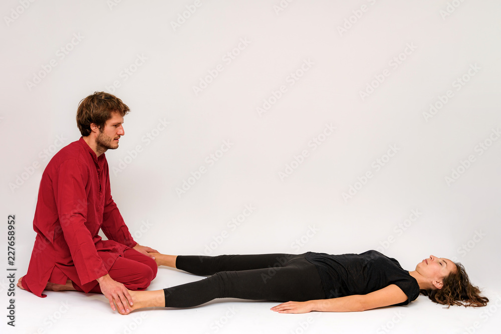 Photo of yoga poses for two stretching and relaxing on a white background. Photo of yoga poses for two stretching and relaxing on a white background.