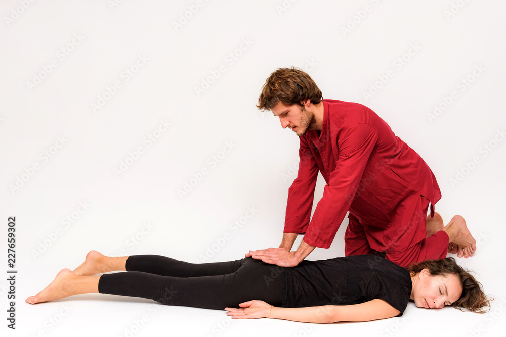 Photo of yoga poses for two stretching and relaxing on a white background. Photo of yoga poses for two stretching and relaxing on a white background.