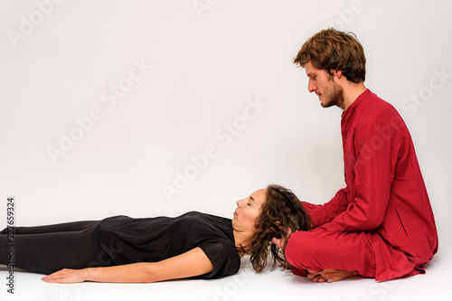 Photo of yoga poses for two stretching and relaxing on a white background.