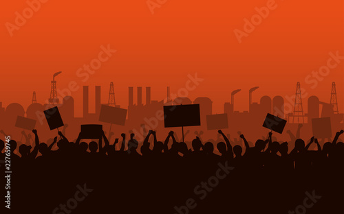 Silhouette group of people Raised Fist and Protest Signs at evening with factory Industrial Estate and orange color sky background