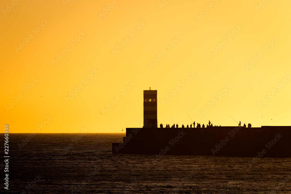 Farol do Pontao and People Silhouettes at Dusk