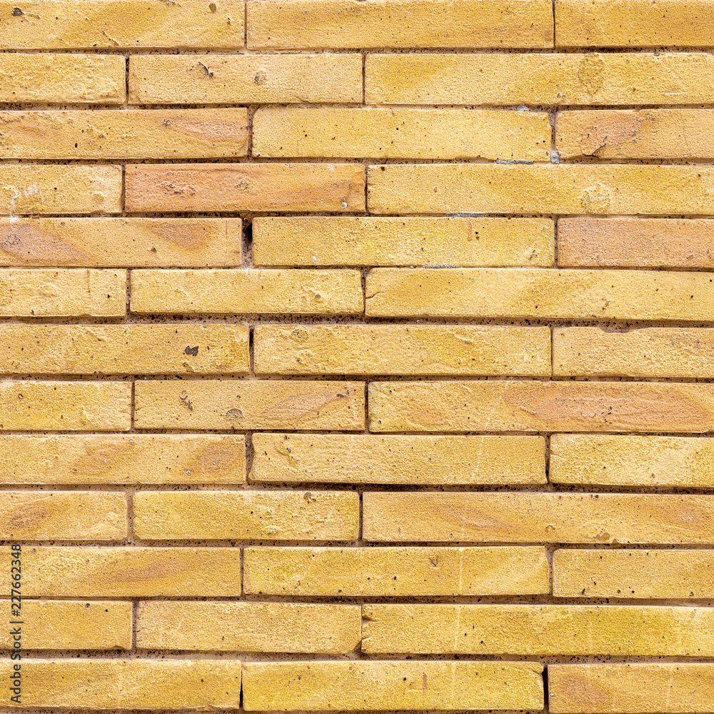 Fototapeta premium Yellow Brick wall texture background