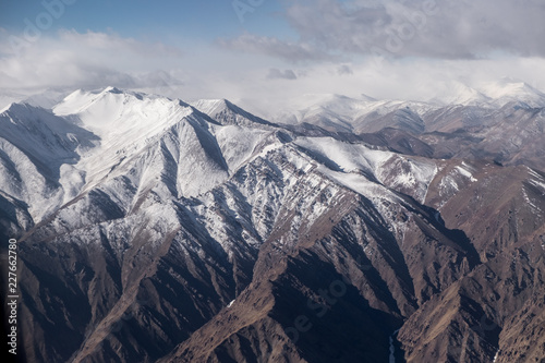 Aerial view lanscape scene of Himalayann range mountain layer with shade and light. photo