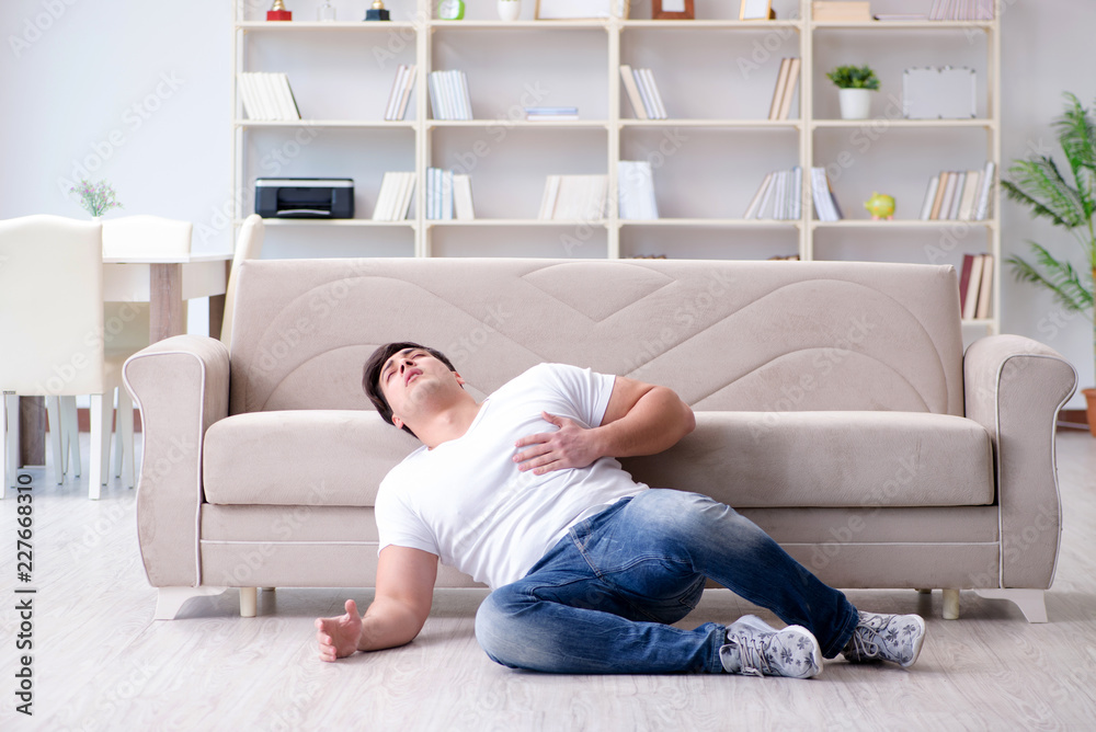 Sick man suffering at home from infection and bad stomach Sick man suffering at home from infection and bad stomach