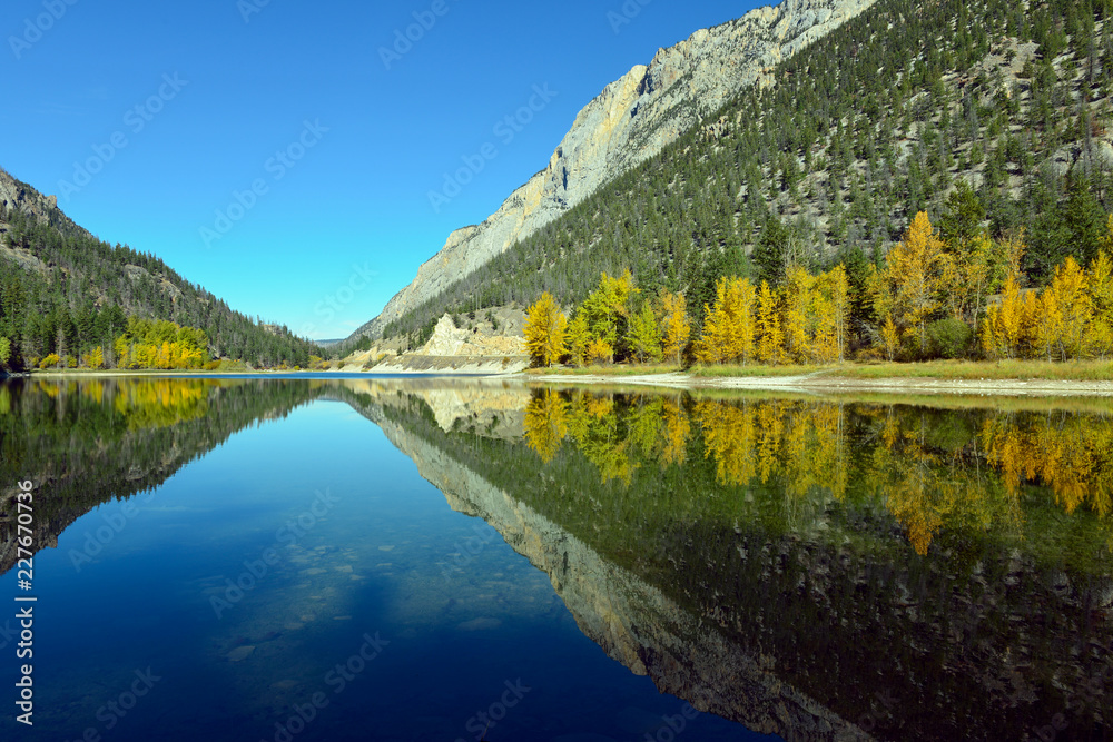 Mountains reflected in Crown Lake in Marble Canyon Provincial Park, British Columbia, Canada