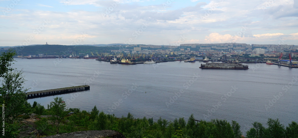 Panoramic view of Kola bay and Murmansk with its busy sea port. Panoramic view of Kola bay and Murmansk with its busy sea port.