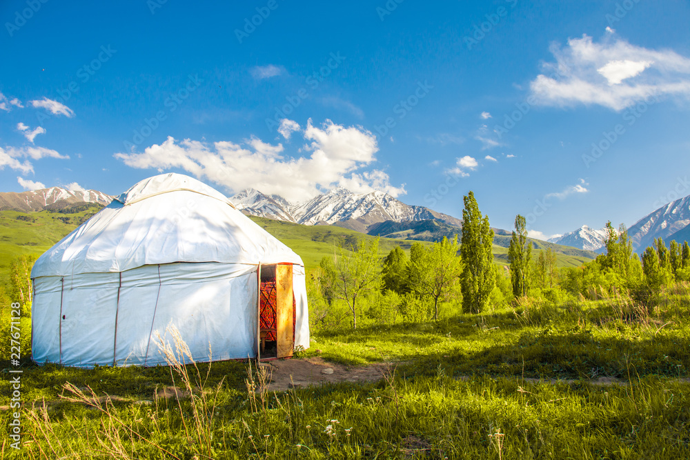 White yurt with mountain backround