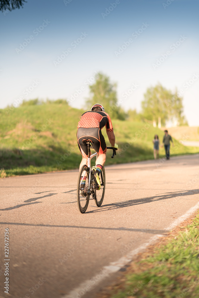 Professional road bicycle racer in action Professional road bicycle racer in action