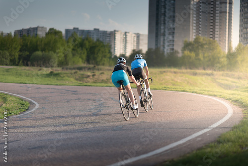 Two Professional road bicycle racers in action photo