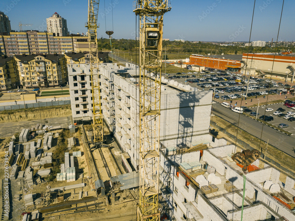 aerial view of construction crane tower on the development building work project f