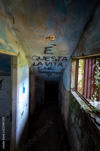 Graffiti and views of the abandoned city of Consonno  Lecco  Italy .