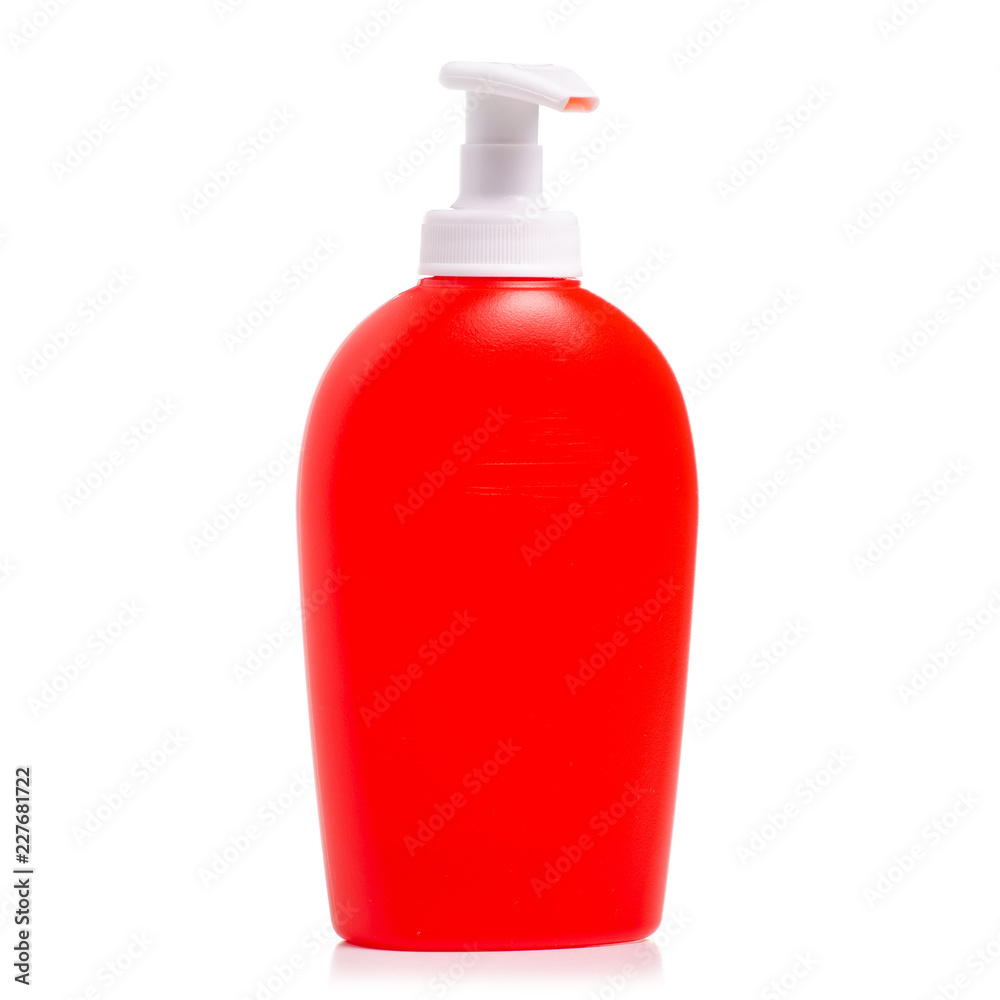 Red bottle with soap dispenser on white background isolation Red bottle with soap dispenser on white background isolation