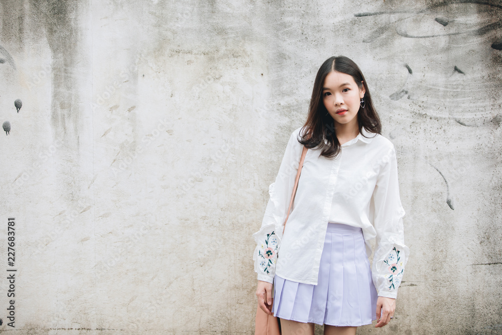 portrait of asian girl with white shirt and skirt looking in outdoor nature vintage film style portrait of asian girl with white shirt and skirt looking in outdoor nature vintage film style