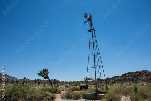 Abandoned old fashioned windmill sits along the trail to the Wall Street Mill, a former mining operation, in Joshua Tree National Park in California